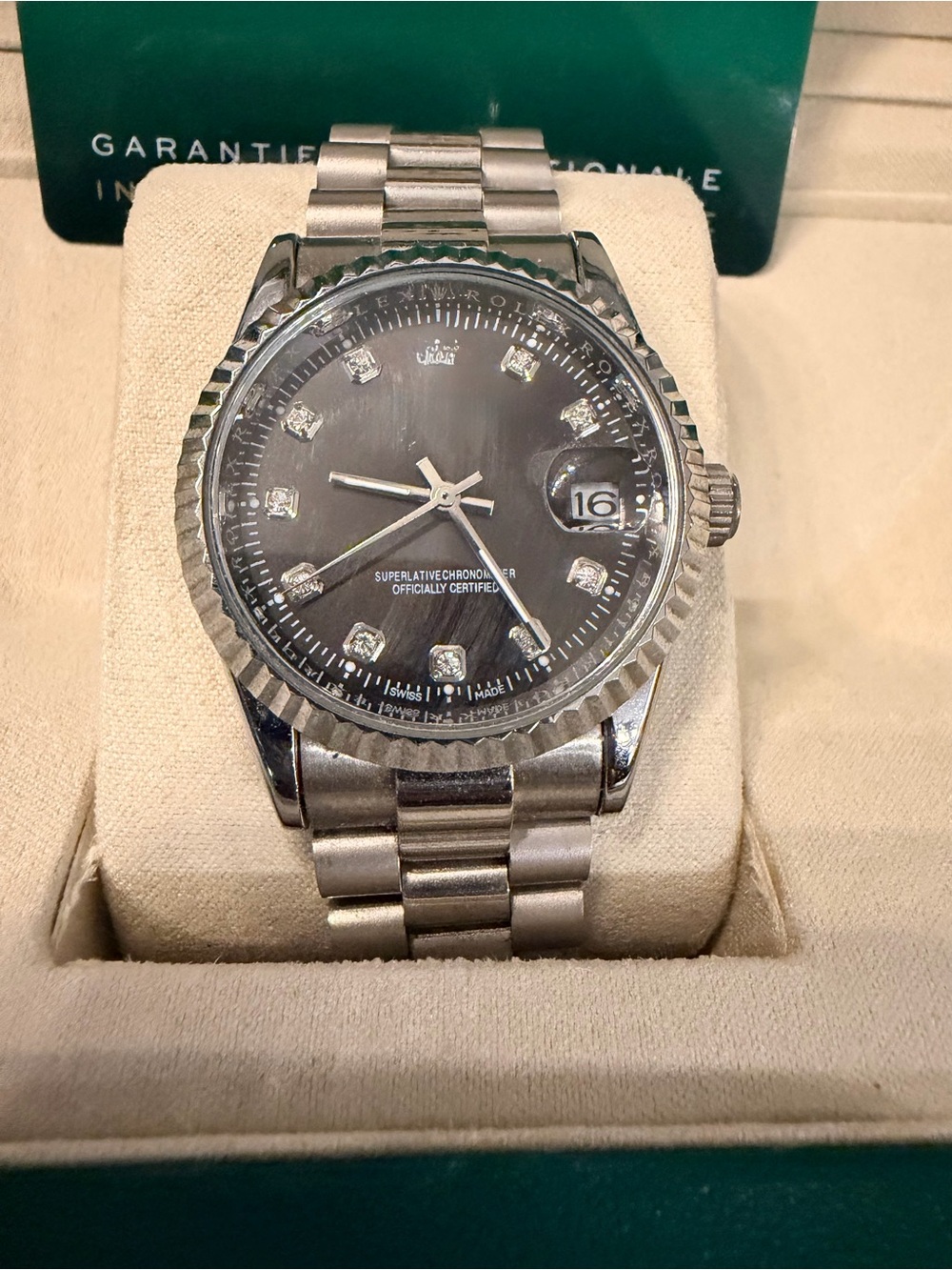 Men’s luxe silver watch with black face with box.